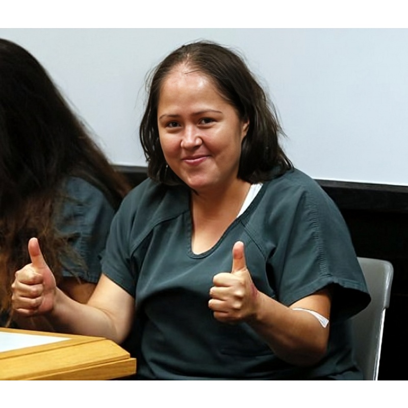 MARIA ISABEL GARDUNO-MARTINEZ | Grinning and giving a thumbs up, an undocumented immigrant woman who is accused of killing her husband and four little children in “horrendous” ways acts strangely during her initial court appearance and claims to be “very